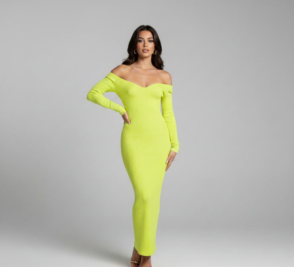 Woman wearing a bright green off-shoulder dress on a gray background